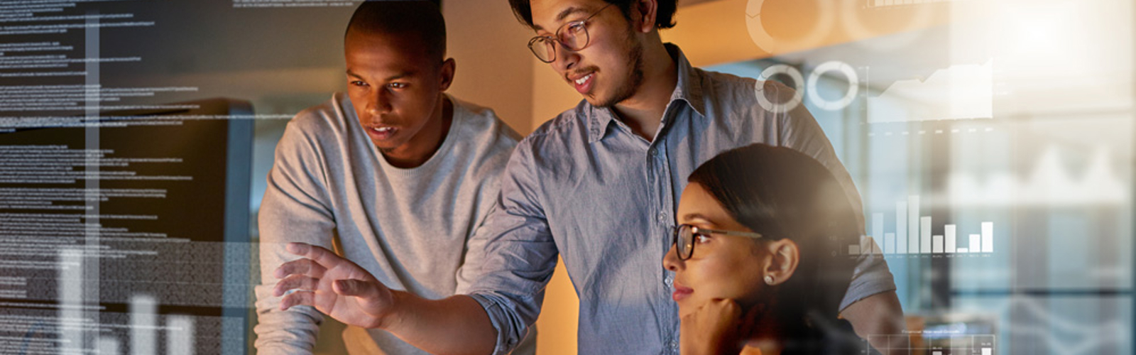 a group of people looking at a computer screen