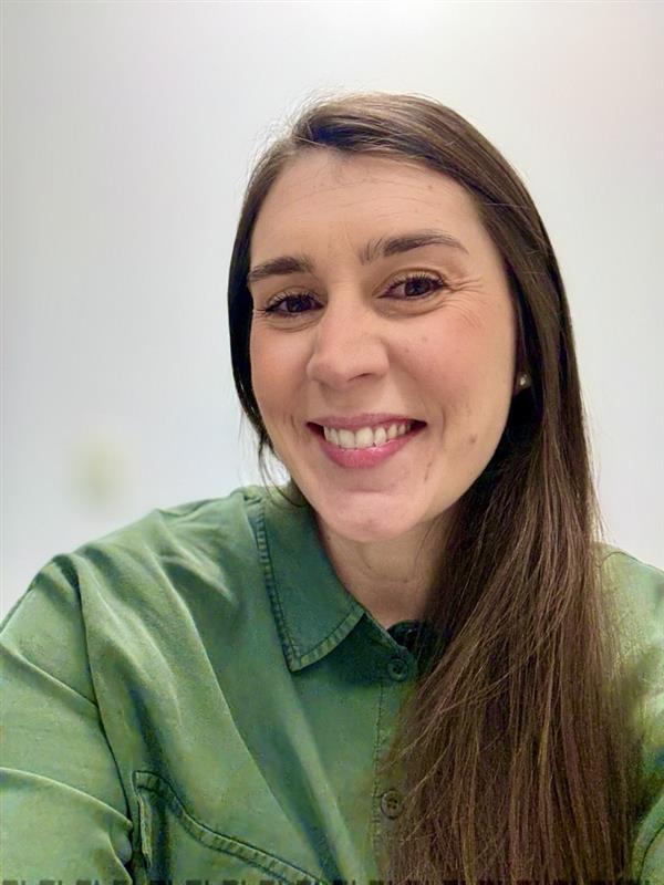 a person smiling at the camera