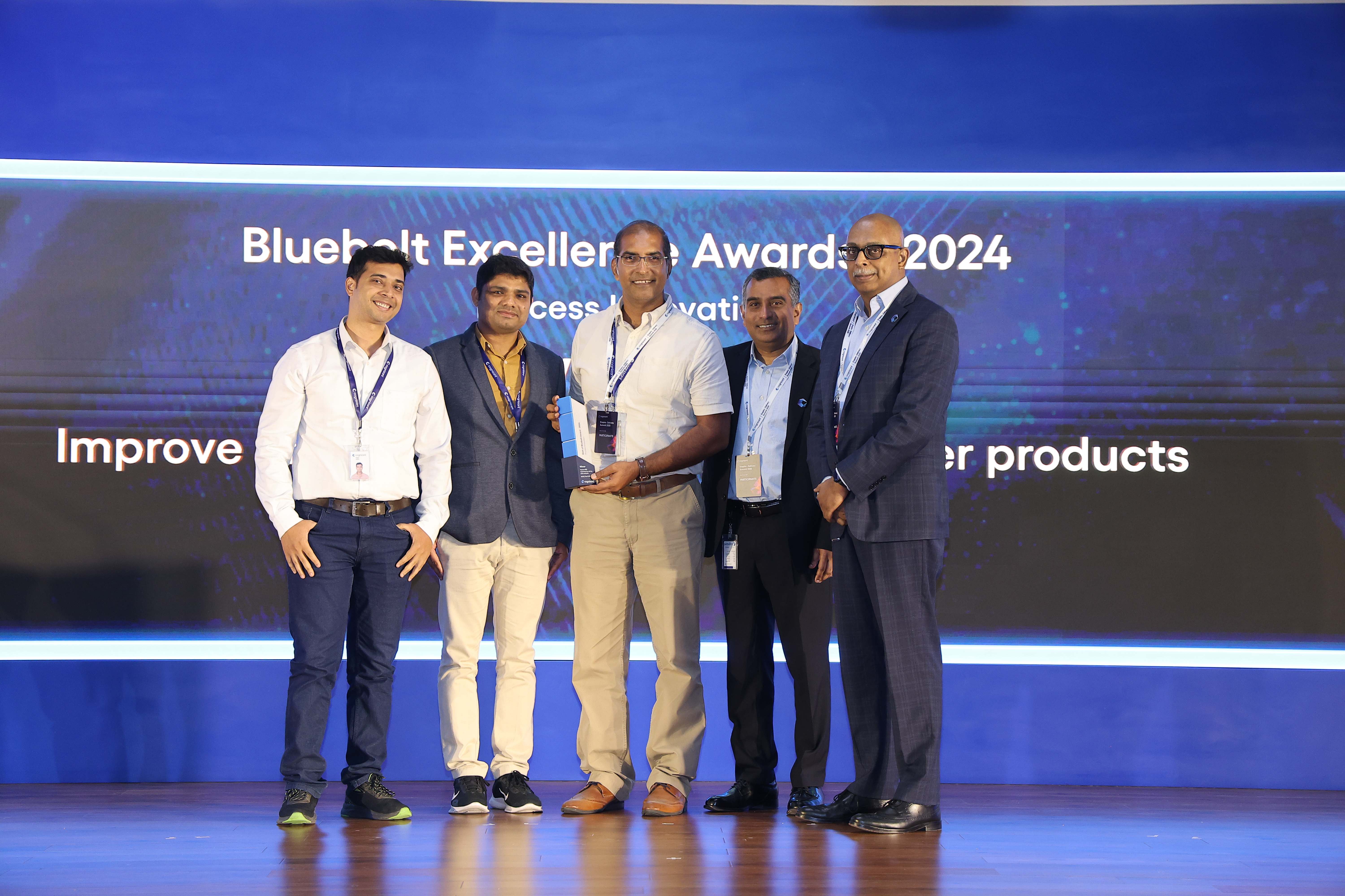 a group of men standing together and smiling