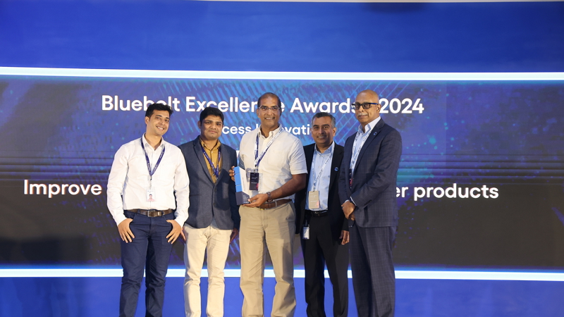 a group of men standing together and smiling