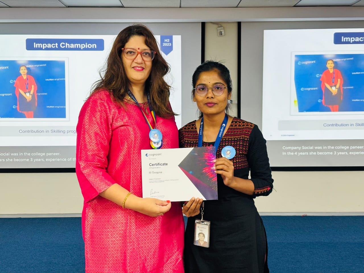 two women holding a certificate