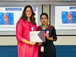 two women holding a certificate