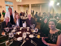 a group of people sitting at a table