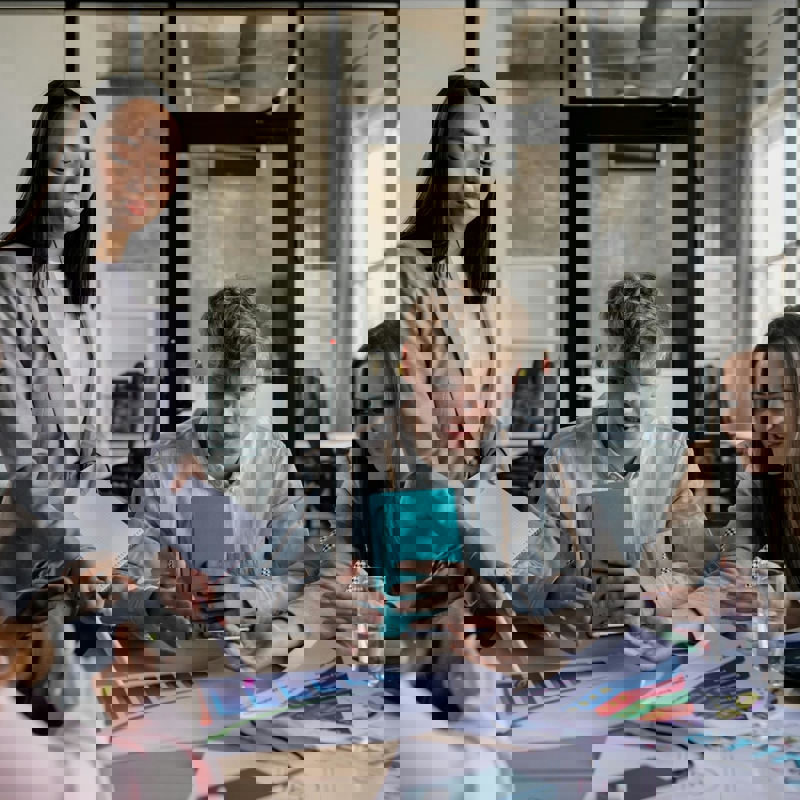 a group of people sitting around a table