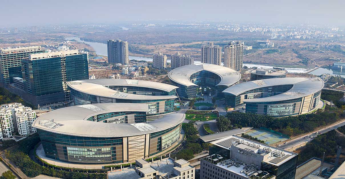 a group of buildings with curved roofs