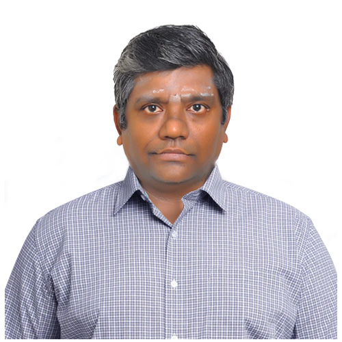 a person with grey hair and a blue checkered shirt