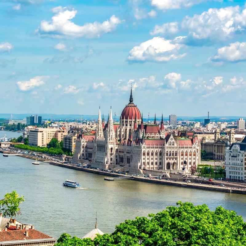 a large building next to a river