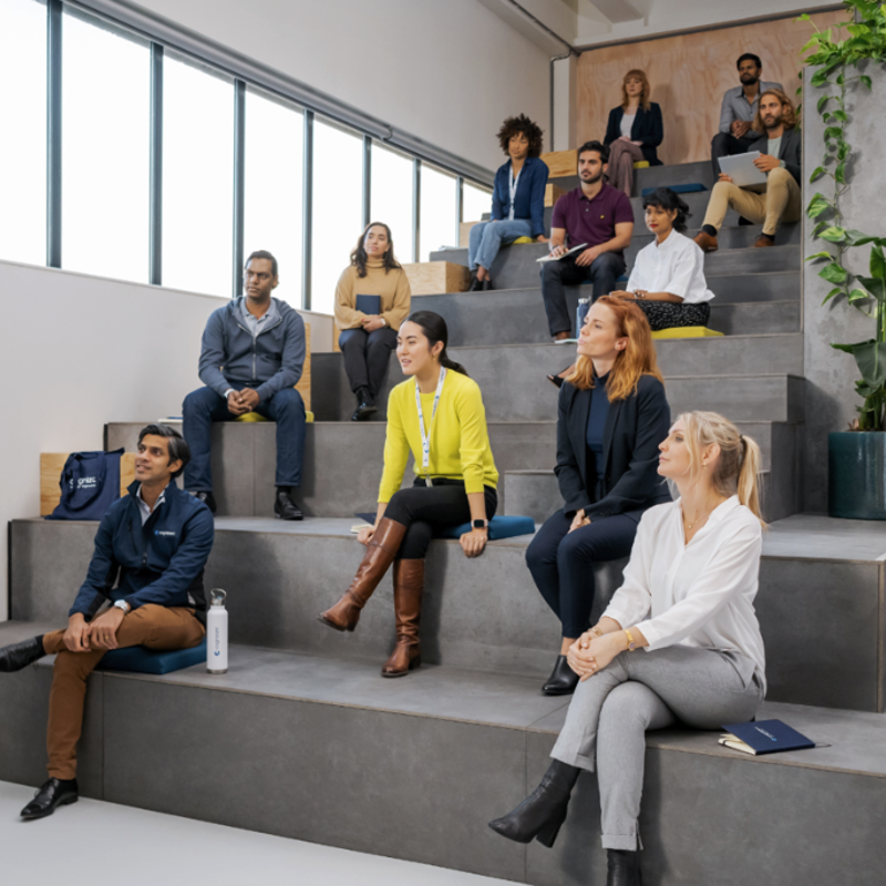 a group of people sitting on stairs