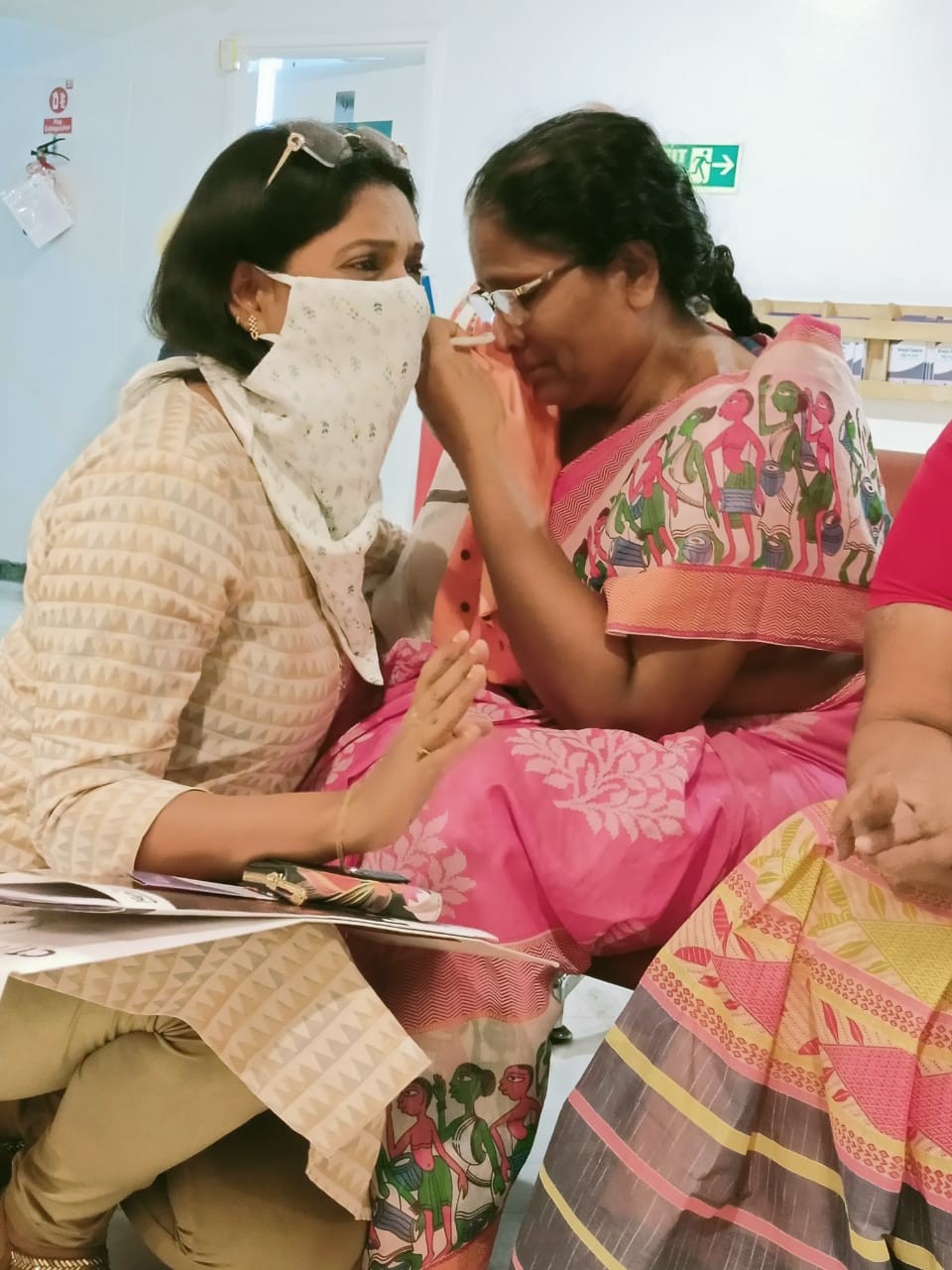 a person putting on makeup on another person