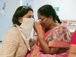 a person putting on makeup on another person