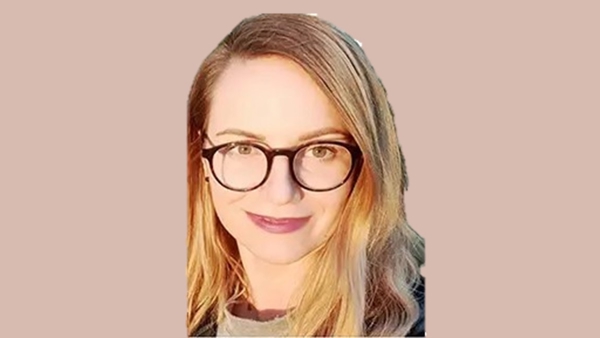 a person with long blonde hair wearing glasses