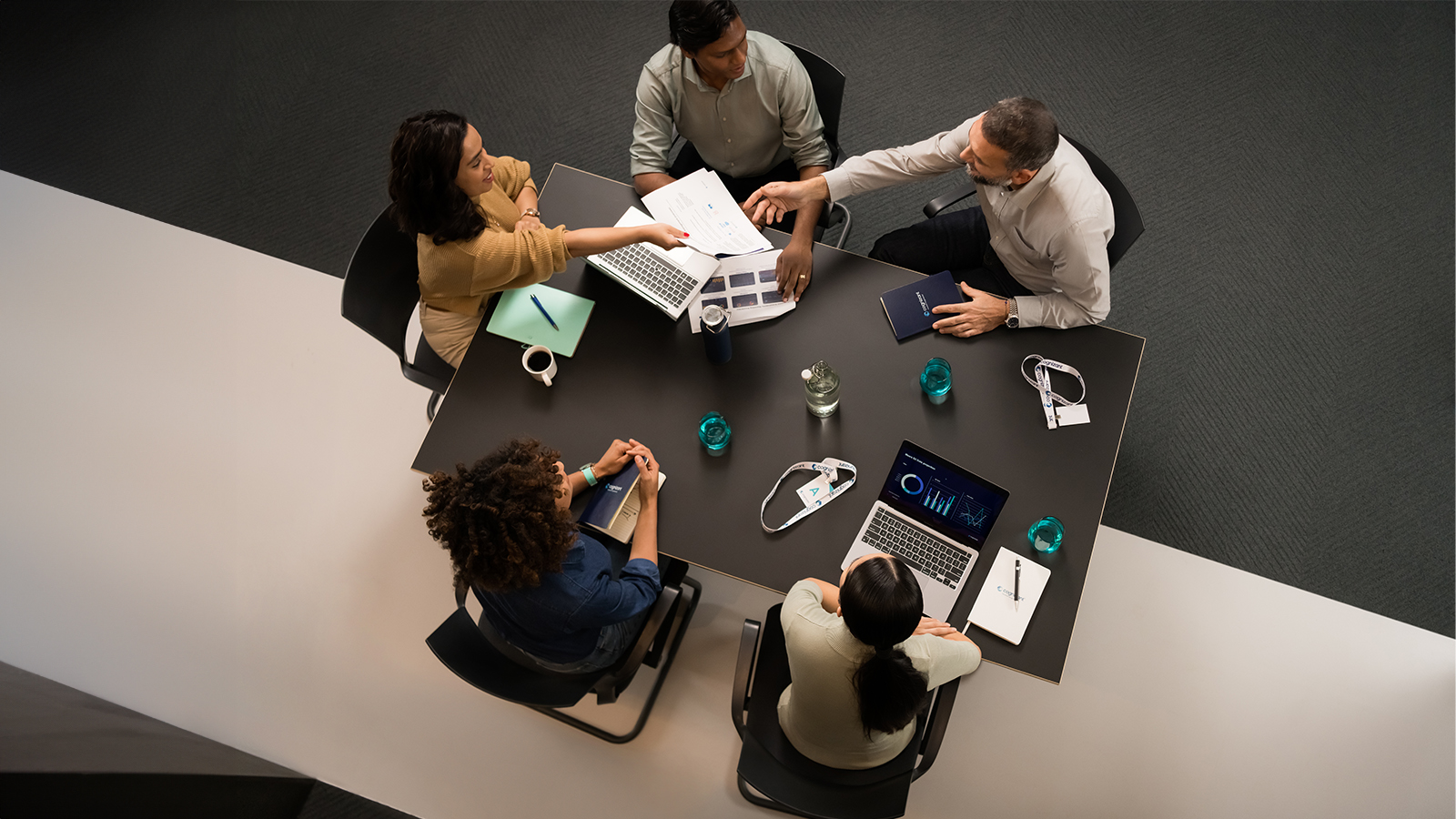 a group of people sitting around a table