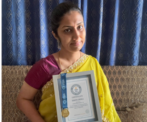 a person holding a framed certificate