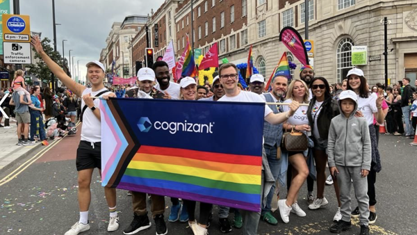 a group of people holding a rainbow flag