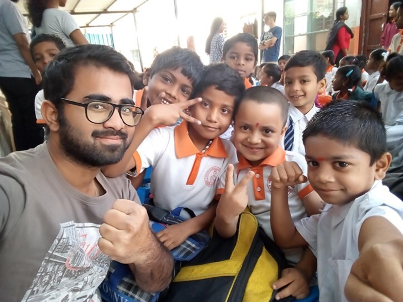 a person and children posing for a picture