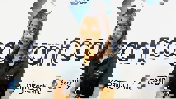 a person standing in front of a sign