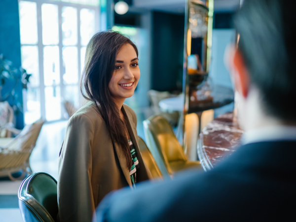 a person smiling at a person