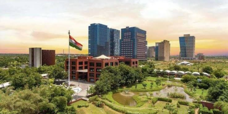 a building with a flag in front of a park