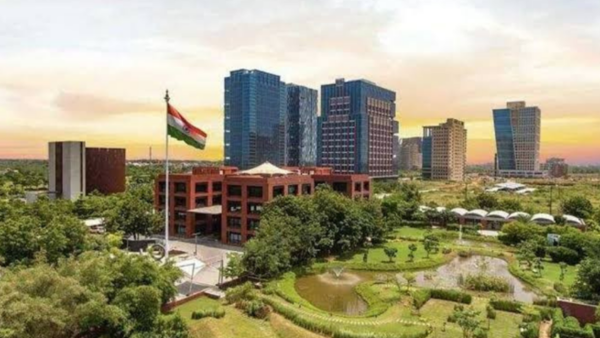 a building with a flag in front of a park