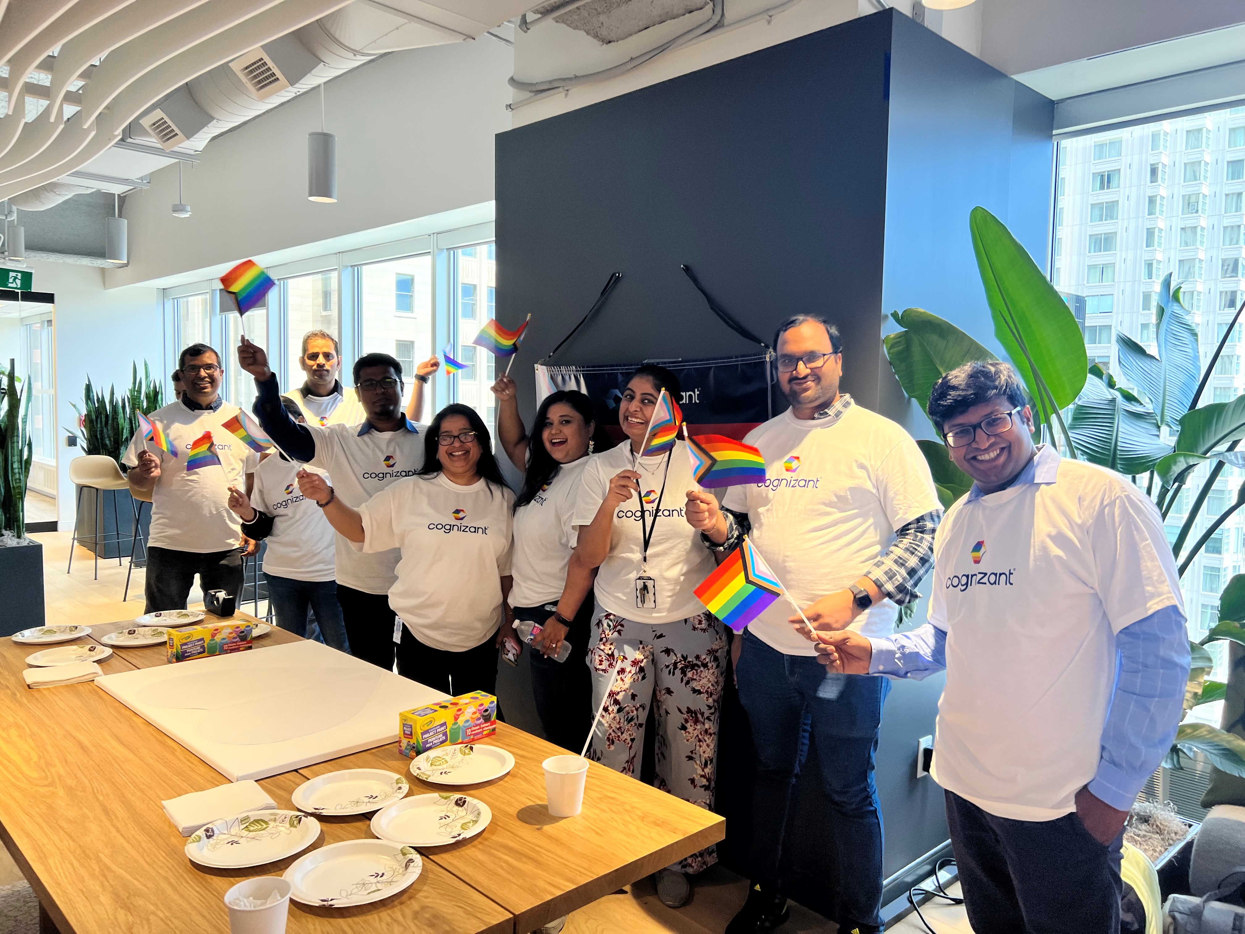 a group of people holding rainbow flags