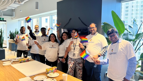 a group of people holding rainbow flags
