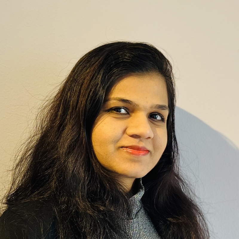 a person with long hair smiling